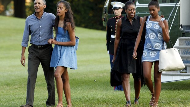 U.S. President Barack Obama, walks with Malia, First lady Michelle and Sasha.