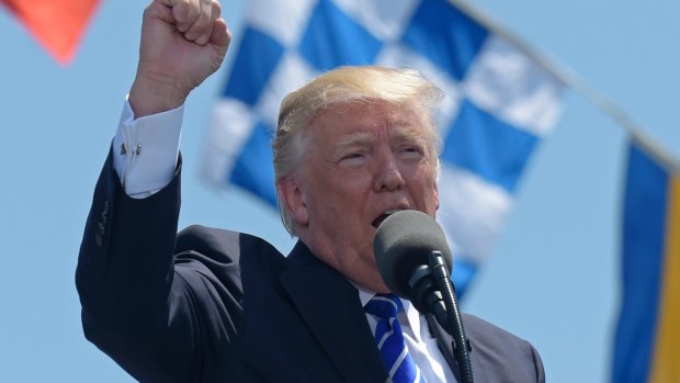 President Donald Trump gestures as he gives the commencement address at the U.S. Coast Guard Academy in Connecticut on Wednesday.