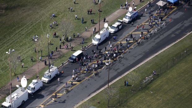 Media and fans gather outside Paisley Park Studios in Chanhassen, Minnesota, where Prince died.