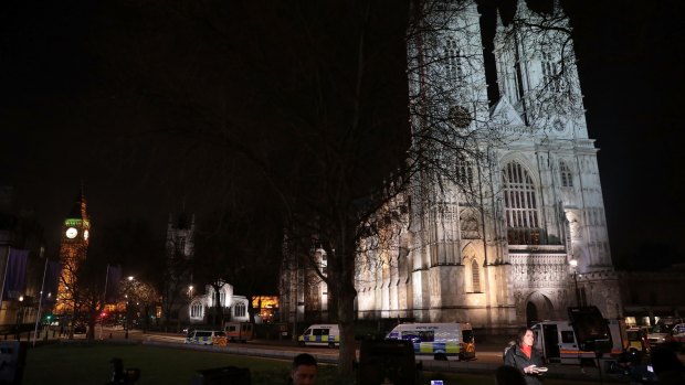 Reporters and emergency services outside Westminster Abbey next to the Houses of Parliament on Wednesday.