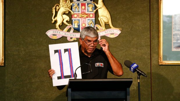 Uncle Lester Maher holds up the number 11, which was his name in the Kinchela Boys' Home. 