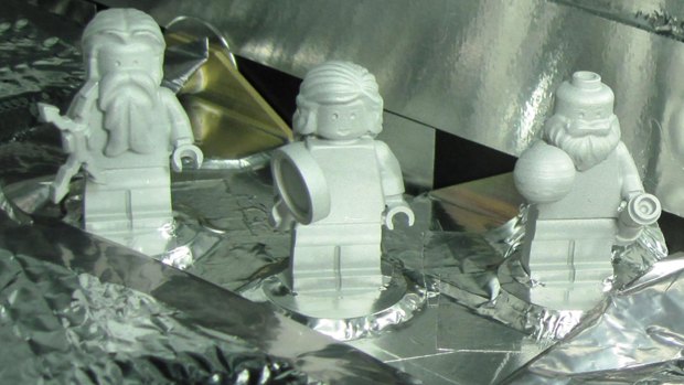 Lego figurines representing, from left, the Roman god Jupiter, his wife, Juno, and Galileo Galilei aboard the Juno spacecraft. The figures are made of aluminium so they can withstand the extreme conditions of space flight.

 
