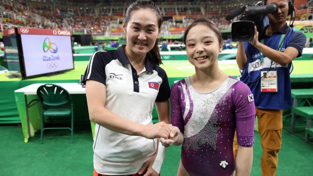 South Korean gymnast Lee Eun-ju, right, and her North Korean counterpart Hong Un-jong during the artistic gymnastics women's qualification at the 2016 Summer Olympics in Rio de Janeiro, Brazil.