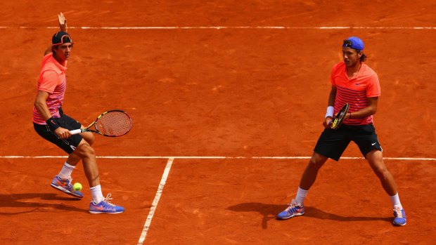 Australian Thanasi Kokkinakis playing doubles with France's Lucas Pouille at the French Open.