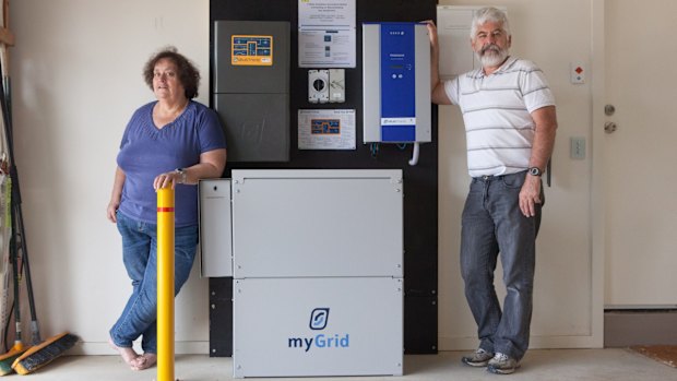 Susan and Ian Wilson with the battery component of their solar panels.