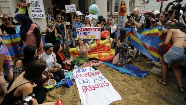 Activists outside the French embassy in London protest against the burkini ban. 