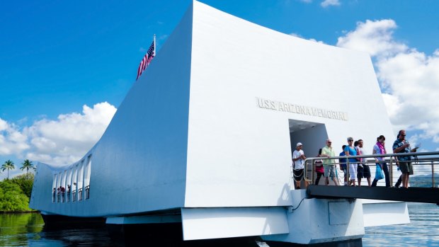 Visitors walking out from the USS Arizona Memorial.