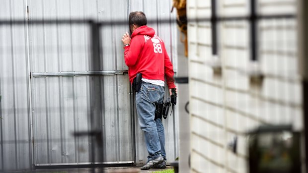 Police executing a search warrant in Footscray on Tuesday.