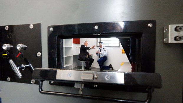 Attorney-General Brad Hazzard and NSW Corrective Services Commissioner Peter Severin  in the cell. 