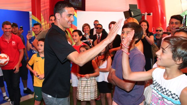 Socceroos star Tim Cahill with fans at the launch of the Asian Cup football fan park at Customs House in Sydney on the weekend.