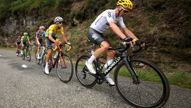 Chris Froome leads yellow jersey Fabio Aru and Romain Bardet up the final climb.