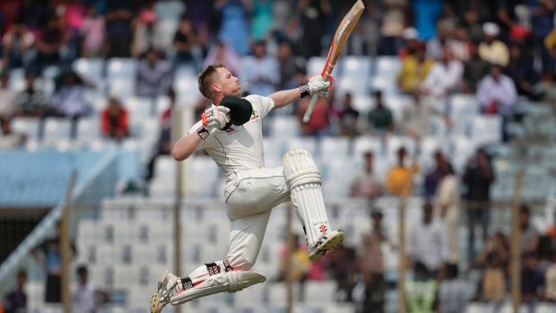 Air time: Australia's David Warner jumps in the air after scoring his second century of the series.