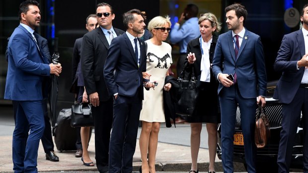 Brigitte (centre) in New York with aides Pierre-Olivier Costa (to her left) and Tristan Bromet (closest at her right).