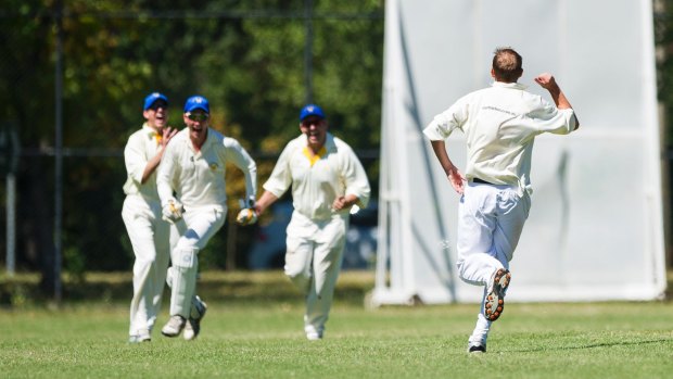 Cricket ACT Douglas Cup: Eastlake Vs North Canberra-Gungahlin. Andrew Murphy celebrates with his team after a wicket. Photo: Dion Georgopoulos