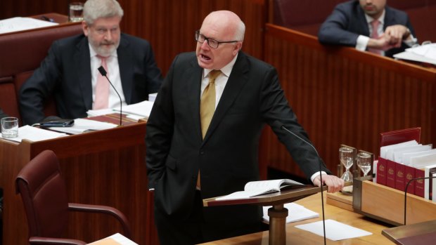 Attorney-General George Brandis attacks Pauline Hanson for wearing the burqa in the Senate.