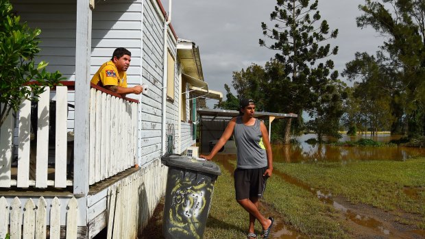 "We had nowhere to go:" Phillip Roberts (left) and Brandan Harrington (right) at their home on the banks of the Wilsons River at Wyrallah.