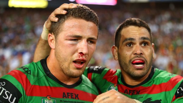 Heading back?: Sam Burgess, pictured with Greg Inglis after winning the 2014 NRL Grand Final with the South Sydney Rabbitohs.