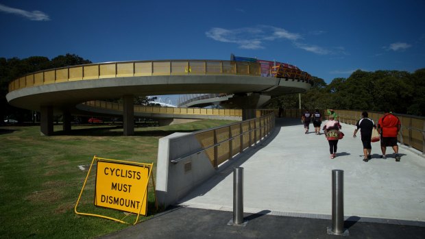 Not impressed: Cricket fans trudge around the Albert "Tibby" Cotter Bridge heading to the SCG.