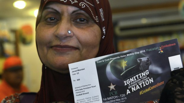 A Pakistani cricket fan displays tickets she purchased for the Pakistan-Zimbabwe series.