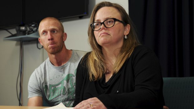 Jenny Heddle, the wife of missing Chisholm man Stuart Heddle,
makes a public plea at the Woden Police Station. At left is Stuart's
brother Ian.