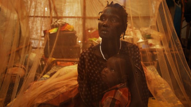 Chol Wechtuor holds her son Dakhoa, whose name translates as "destruction of the world", inside the United Nations-run Protection of Civilians site on the outskirts of Juba, South Sudan's capital.