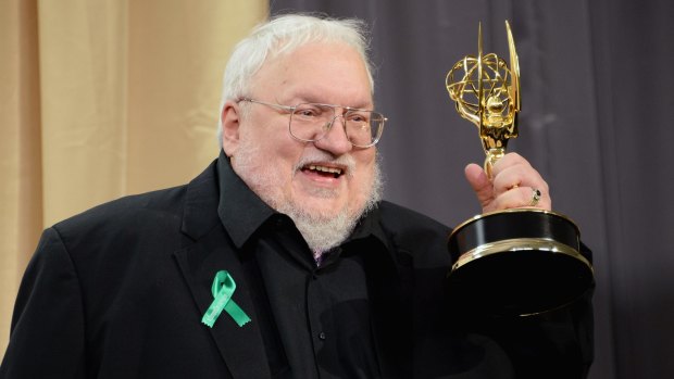 Full of stories ... <i>Game of Thrones</i> creator George RR Martin clutches his award from the recent Emmys.