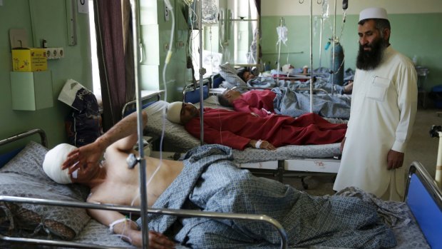 Wounded men lie on their beds in Wazir Akbar Khan Hospital in Kabul.