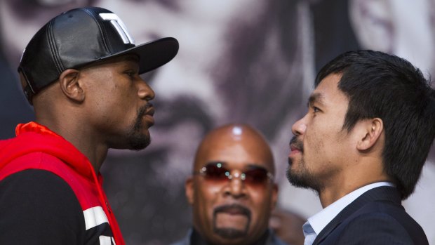 Let's get ready to rumble: Floyd Mayweather jnr (left) and Manny Pacquiao prepare for battle.