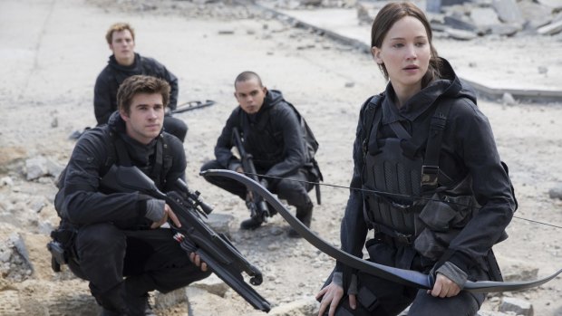 Last hurrah ... Lawrence in the upcoming The Hunger Games: Mockingjay - Part 2, with Liam Hemsworth, front left, as Gale Hawthorne, Sam Claflin, back left, as Finnick Odair, Evan Ross, back right, as Messalla. 