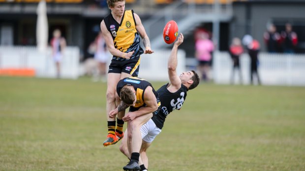 Ainslie's Matthew Thompson pulls in a nice one-handed mark. He kicked four goals.