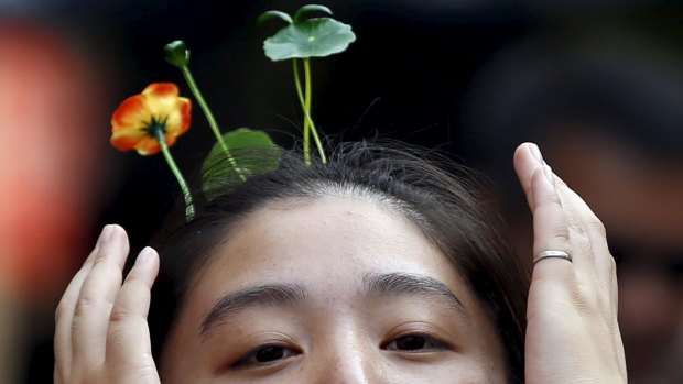 Sprouts, flowers, vegetables worn in the hair: China's new reaction to the bleak landscapes of many of the nation's cities. 