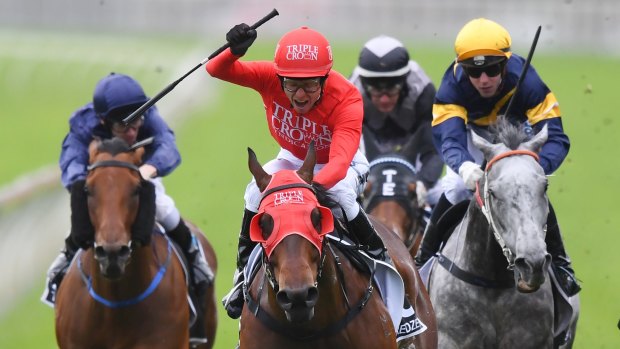 Conquering The Everest: Kerrin McEvoy on Redzel raises his arm at the finish line.
