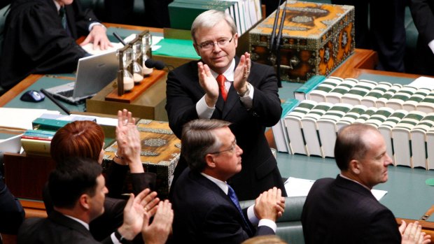 Kevin Rudd applauds members of the stolen generation in the public gallery at Parliament House after delivering his apology in 2008. 