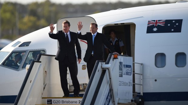 David Cameron and Tony Abbott arrive at Brisbane Airport. 