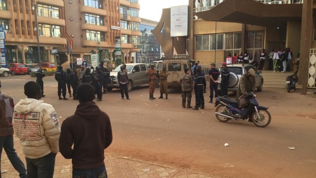 Security forces gather near the hotel that was attacked.