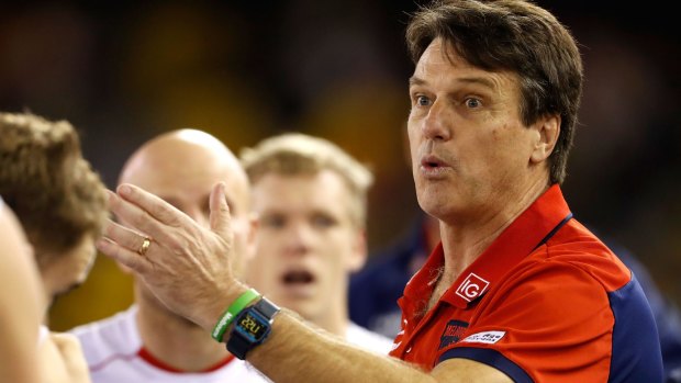 Melbourne coach Paul Roos says the rushed behind rule is too difficult to umpire.