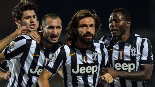 Andrea Pirlo celebrates his goal with his Juventus teammates.