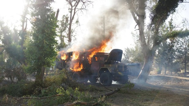A government military truck aflame after it was captured by rebels.