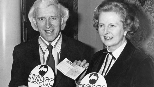 British Prime Minister Margaret Thatcher with Jimmy Savile during a fundraiser for a children's charity in 1980.