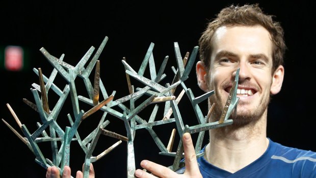 Andy Murray holds the Paris Masters trophy.