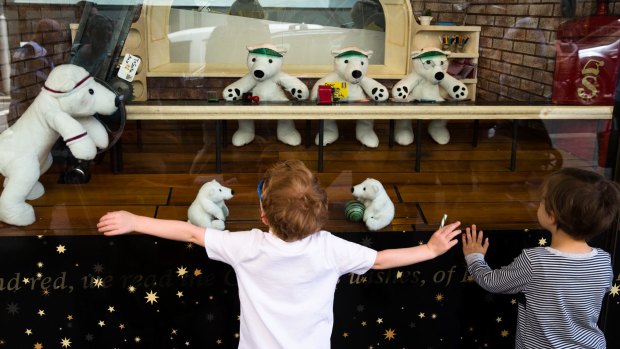Children look at the Christmas displays in David Jones' windows in Sydney.