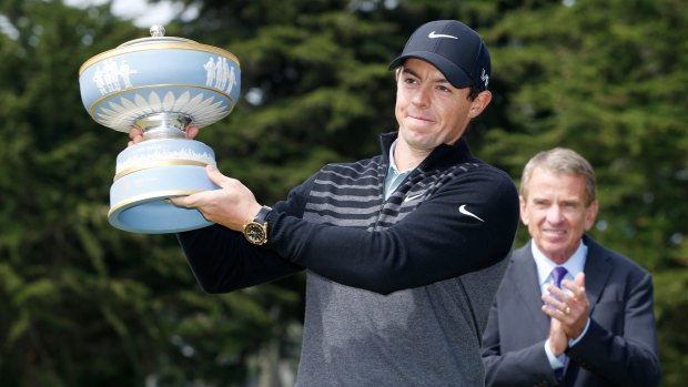 Rory McIlroy lifts the Walter Hagen Cup.