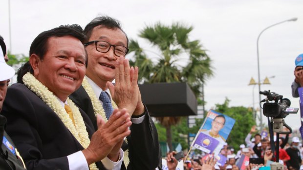 Opposition leader Kem Sokha, left, with his ill-fated predecessor Sam Rainsy in 2013.