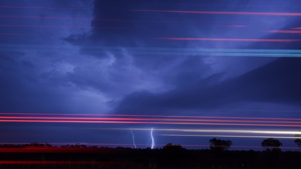 Lightning and truck lights combine as a big storm moved through western NSW on Wednesday.