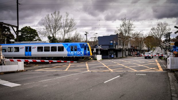 A train goes through the re-opened Union Road level crossing on Thursday morning. 