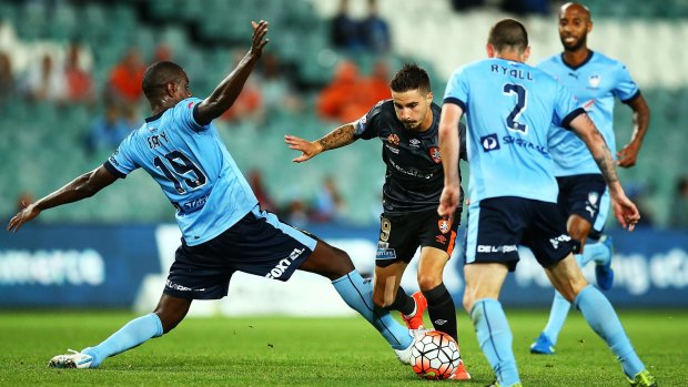 Flash of skill: Brisbane's Jamie Maclaren cuts inside Sydney FC defender Jacques Faty.