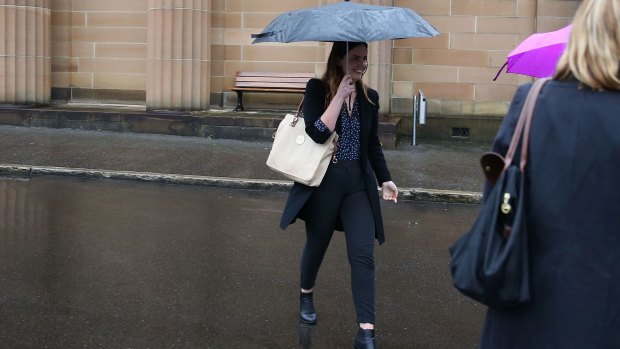 Lucy McNamara attempts to evade the media after Friday's sentencing.