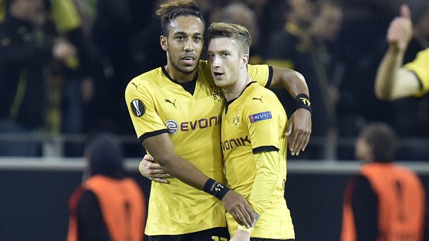 Dortmund's second goal- scorer Pierre-Emerick Aubameyang (left) celebrates his goal with the scorer of the first goal, Marco Reus.