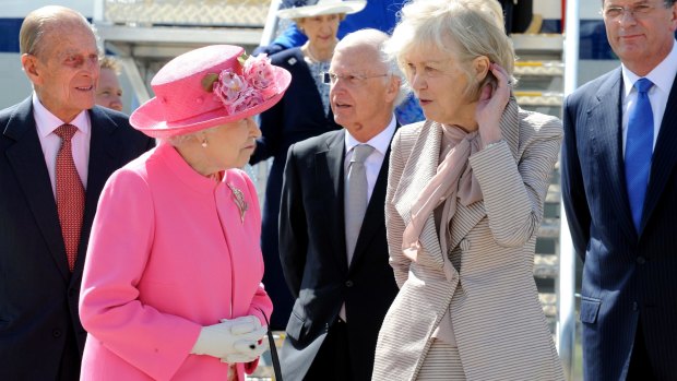 Queen Elizabeth chats to Elizabeth Chernov on the monarch's arrival at Melbourne Airport on October 26, 2011. The Duke of Edinburgh, left, Victorian Governor Alex Chernov and Premier Ted Baillieu are behind them.