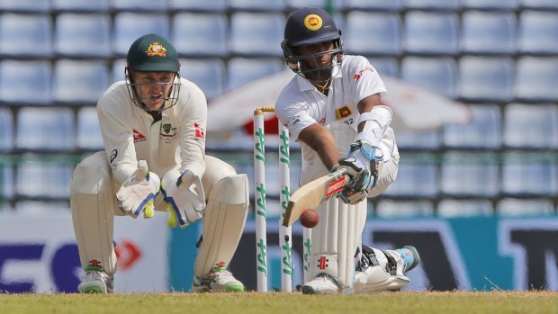 Sweeping success: Kusal Mendis plays a shot on his way to a maiden Test century.